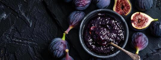 Figs and Bowl of Jam on Table photo