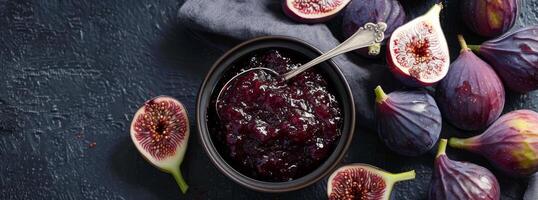 Bowl of Jam Surrounded by Figs on Table photo