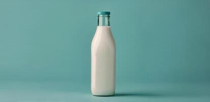 Bottle of Milk on Blue Background photo