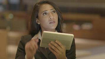 Confident Woman Browsing the Web Internet on Mobile Tablet Device video