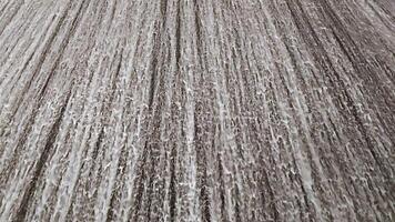 Textured Roof with Snowflakes, Close-up view of a textured roof surface covered in fresh, melting snowflakes, emphasizing the details and patterns created by the weather. video