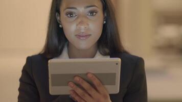 Confident Woman Browsing the Web Internet on Mobile Tablet Device video