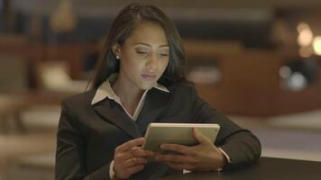 Confident Woman Browsing the Web Internet on Mobile Tablet Device video