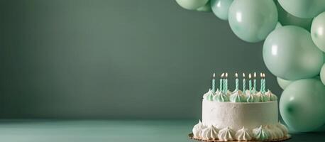 Birthday Cake With Candles and Balloons photo