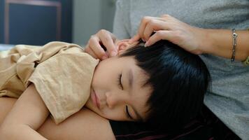 Little Asian child showing love to his mother by hugging video