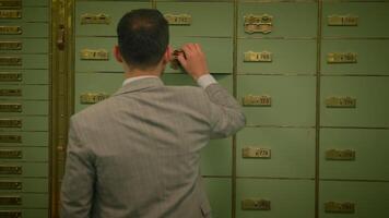 Male Business Person Inside Vault Safe Strongroom Using Deposit Box video