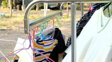 Outdoor clothes drying rack that is blown around by the wind. video