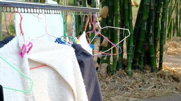 Outdoor clothes drying rack that is blown around by the wind. video