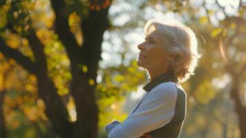 Older Woman Stretching in Park at Sunset photo