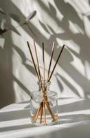 Glass Vase With Reeds on Table photo