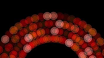 Red circles on black background create a striking pattern video