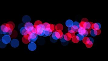 Vibrant red and blue circles create a striking pattern on a black background video