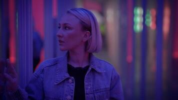 Young Blond Woman Exploring Room of Mirrors in Dreamlike Fantasy Neon Light video