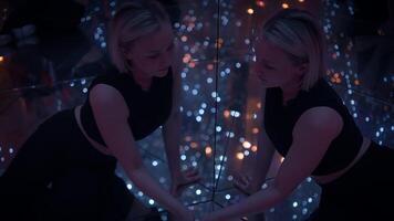 Young Blond Woman Exploring Room of Mirrors in Dreamlike Fantasy Neon Light video