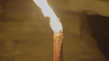 Person Holding Flaming Burning Torch Light In Stone Cave Forest At Night video