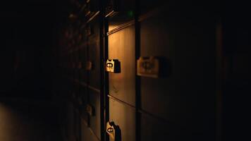 A row of lockers in a dark room with automotive lighting video