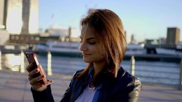 Young Beautiful Caucasian Woman Using Smart Phone in the City video