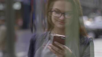 Young Beautiful Caucasian Woman Using Smart Phone in the City video