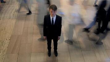 Man Standing Out Of The Crowd People Walking on Crowded Street video