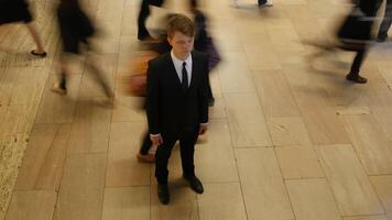 Young Businessman Surrounded By Pedestrians Commuting in the City Streets video