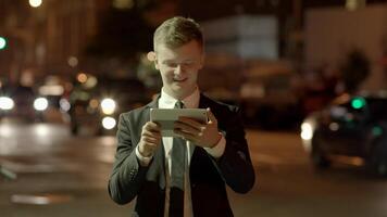 Young Businessman Using Tablet Screen Device in the City video