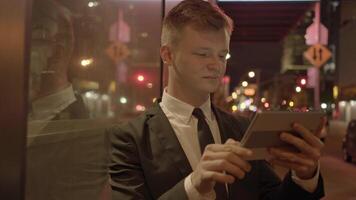 Young Businessman Using Tablet Screen Device in the City video