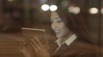 Confident Woman Browsing the Web Internet on Mobile Tablet Device video