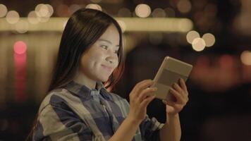 Young Asian Woman Using Smart Phone Tablet In the City Streets video