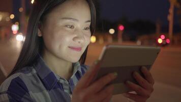 Young Asian Woman Using Smart Phone Tablet In the City Streets video