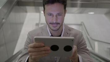 Portrait of Young Successful Man Using Tablet Screen on Business Travel Trip video