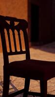 A wooden chair sitting on a cobblestone street video