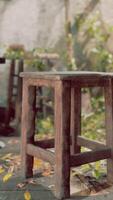 A neglected wooden stool on a grimy floor in an abandoned room video