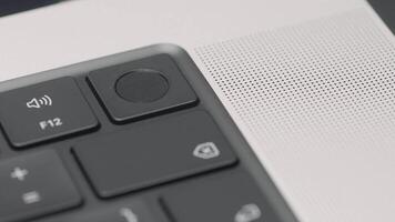 Extreme close up of black keyboard and silver laptop. Action. Buttons of a portable computer keypad. video