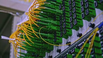 Close up of optical fiber switchboard hub in a server room. Stock footage. Concept of AI, internet, and modern technologies. video