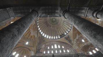 Columns and vault of temple. Action. View from below on beautiful inner vault of dome of temple. Interior of mosque or temple with columns video