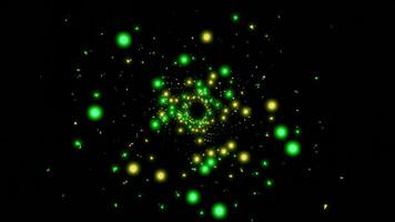 Black background.Design. Bright yellow and green shiny particles shine all over the background and move inside the footage in abstraction video