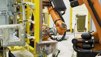 Japan - Tokyo, 12.10.2021. Robots assembling car parts at the Museum of Industry and Technology. Scene. Robotics arms during work process. video