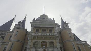 Bottom view of beautiful Massandra palace in Crimea, Russia. Action. Amazing castle on cloudy sky background, concept of architecture. video