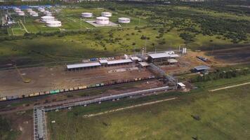 Type of factories. Clip. View from the height of the bird's field on special equipment for heavy work and production. video