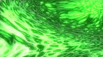 macchie di verde inchiostro su il acqua superficie, astratto colorato sfondo. design. fluido raggiante struttura fluente lentamente. video
