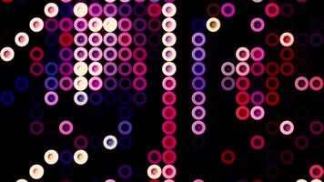 Abstract round shaped colorful buttons moving on a black background, seamless loop. Motion. Ring silhouettes running in purple tones. video