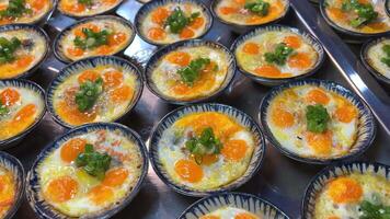 Omelette Fried egg with spices are laid out from frying pan on plate. Top view close-up. video