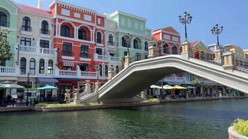 Bridge river colorful houses beautiful creation of virtual reality in the real world in city Grand World video