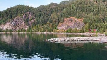 Porteau Cove Provincial Park has waterfront campsites overlooking Howe Sound and mountains beyond. The old vessel was sunk to attract divers and marine life. There are special conditions for divers video