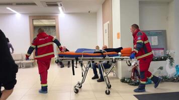 Medical transportation by ambulance at ambulance station in Kyiv hospital corridor emergency stretcher Stretchers are mostly utilized in hospital settings to transport people need medical attention video