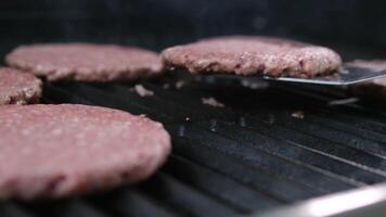 Grilled cutlets Preparation of beef cutlets. cutlet is fried in a grill pan, close-up video