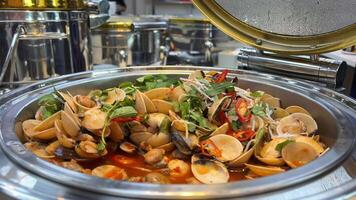 Shells molluscs food Pour Cream over Mussels and Vegetables, Close-Up. Water Boils in the Skillet. In Slow Motion. video