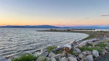 sunset on the Ocean Horizon many clouds and bright colors from the sun in the sky slow motion suitable for music relaxation background For text silence peace Parksville beach Surfside RV resort video