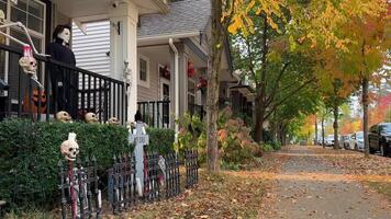 Trick or Treat Halloween decorations at home Witches hung on the porch Introducing Skeletons, Bones America brightly celebrate Halloween house is ready to receive children to give them sweets video