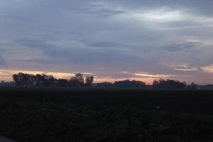 cloudy sunrise in the netherlands photo